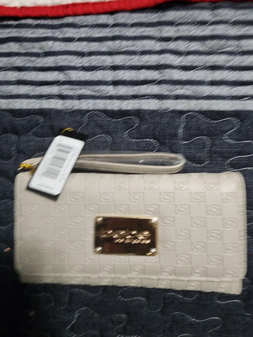 Bebe Cream Wristlet Clutch with Gold Plaque